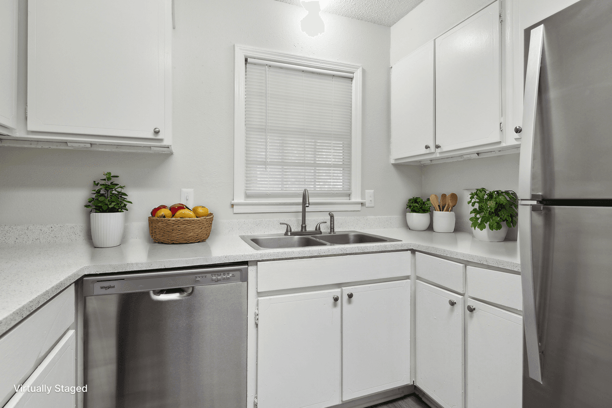 Virtually staged kitchen in a Quail Run apartment home