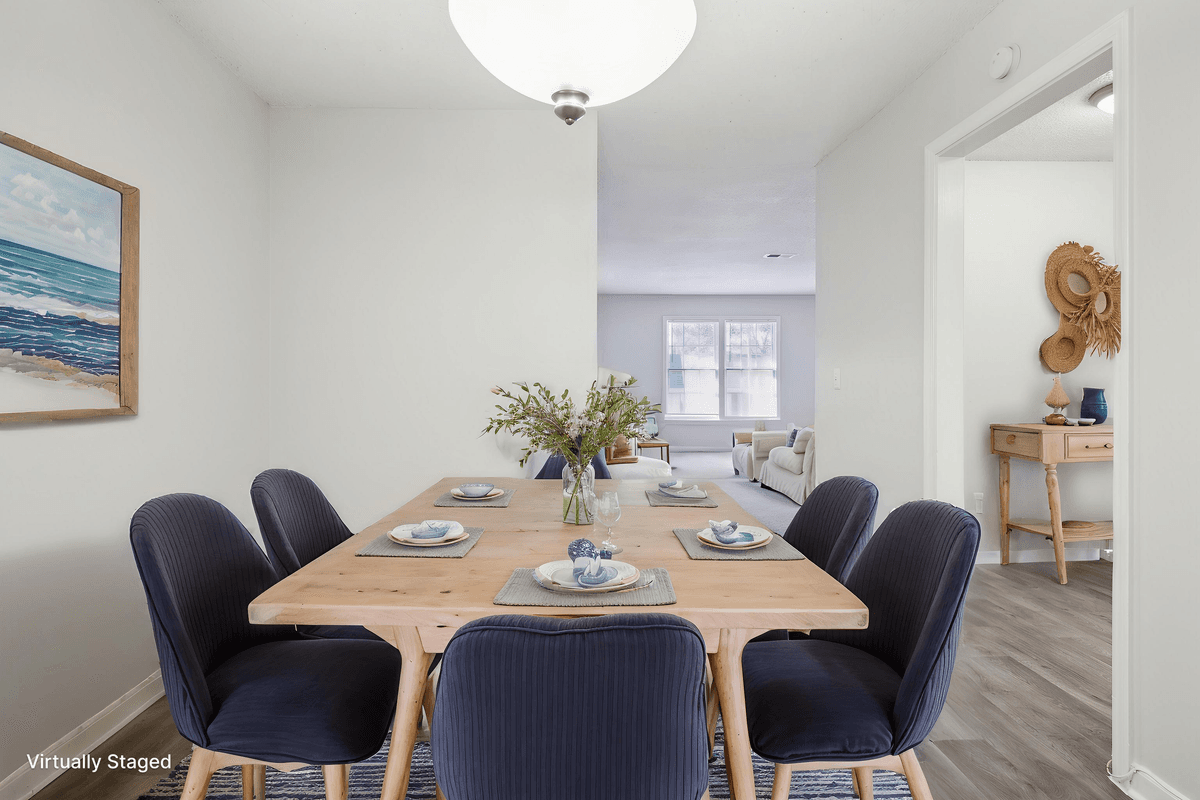 Virtually staged dining area in a Quail Run apartment home
